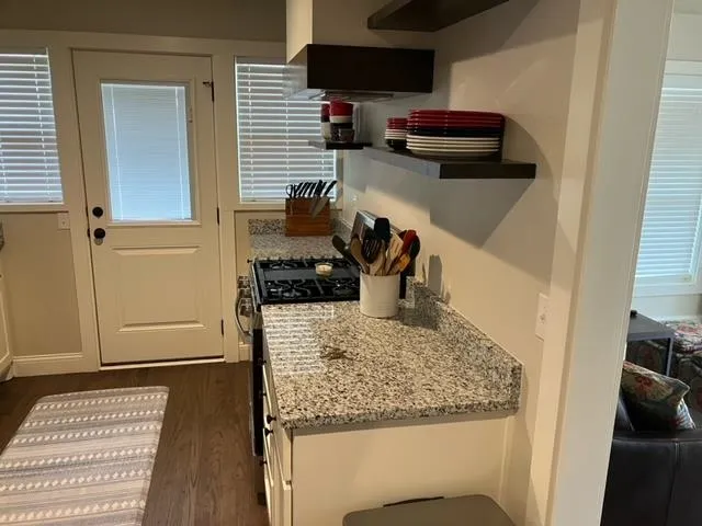 a kitchen with a stove and a refrigerator