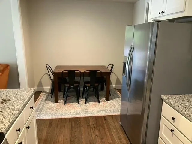 a view of kitchen island wooden cabinets and outdoor space