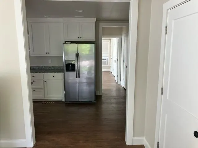 a view of kitchen with wooden floor