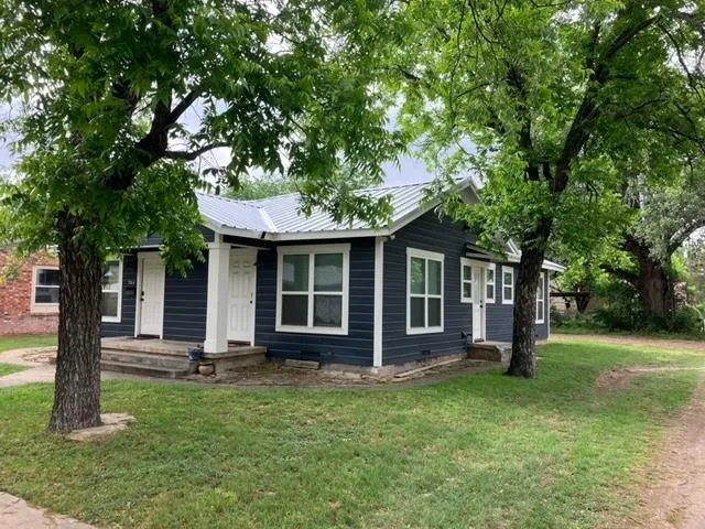 front view of a house with a yard