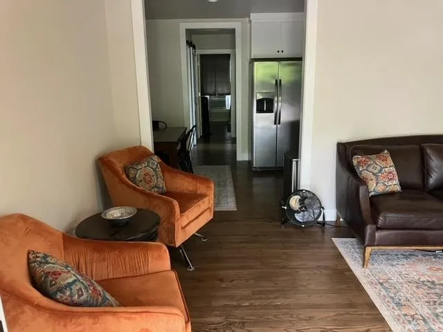 a living room with furniture and a rug