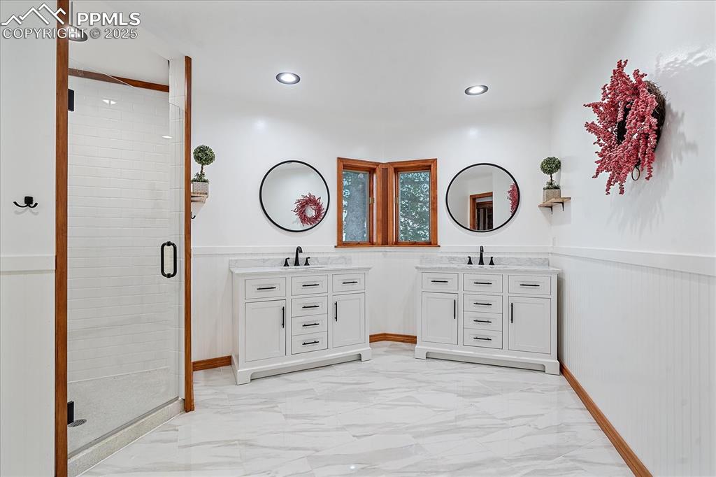 8045 Eagle Road Larkspur, CO 80118 - Photo 19 of 50 wooden floor with cabinet a mirror and a white walls