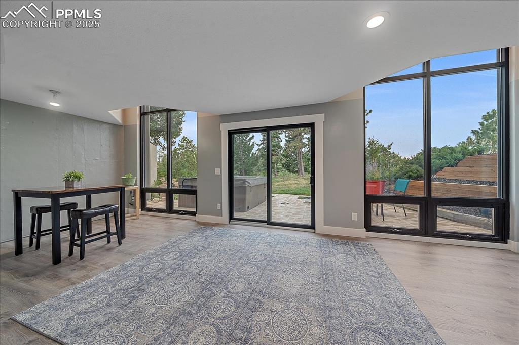 8045 Eagle Road Larkspur, CO 80118 - Photo 32 of 50 an empty room with sliding door and a window