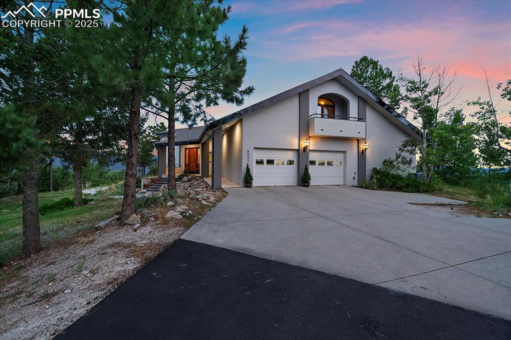 8045 Eagle Road Larkspur, CO 80118 - Photo 43 of 50 a view of a house with a yard and large trees