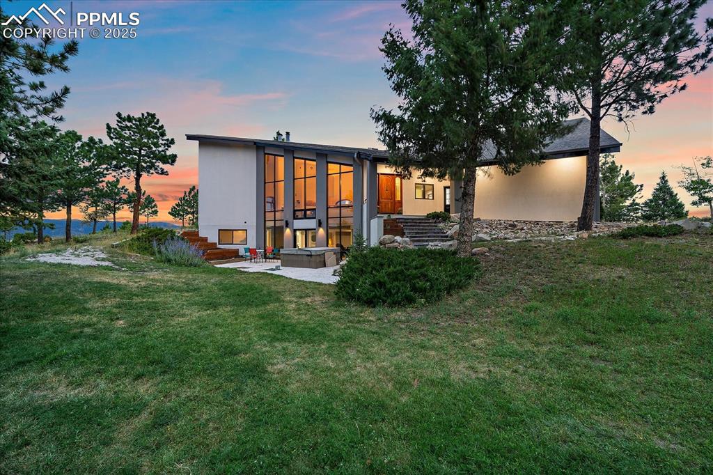 8045 Eagle Road Larkspur, CO 80118 - Photo 45 of 50 a view of a house with a backyard