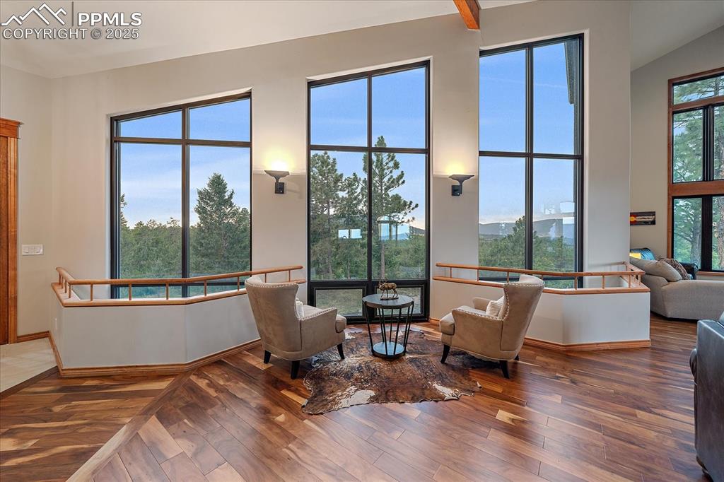 8045 Eagle Road Larkspur, CO 80118 - Photo 5 of 50 a living room with furniture and large windows
