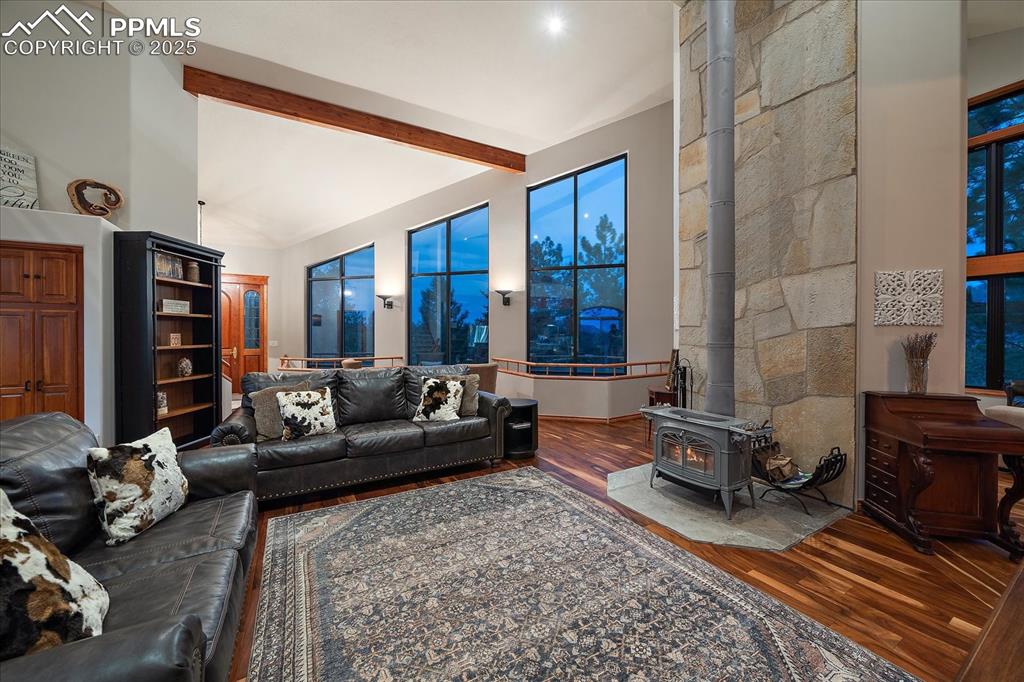8045 Eagle Road Larkspur, CO 80118 - Photo 6 of 50 a living room with furniture or couch and a fireplace