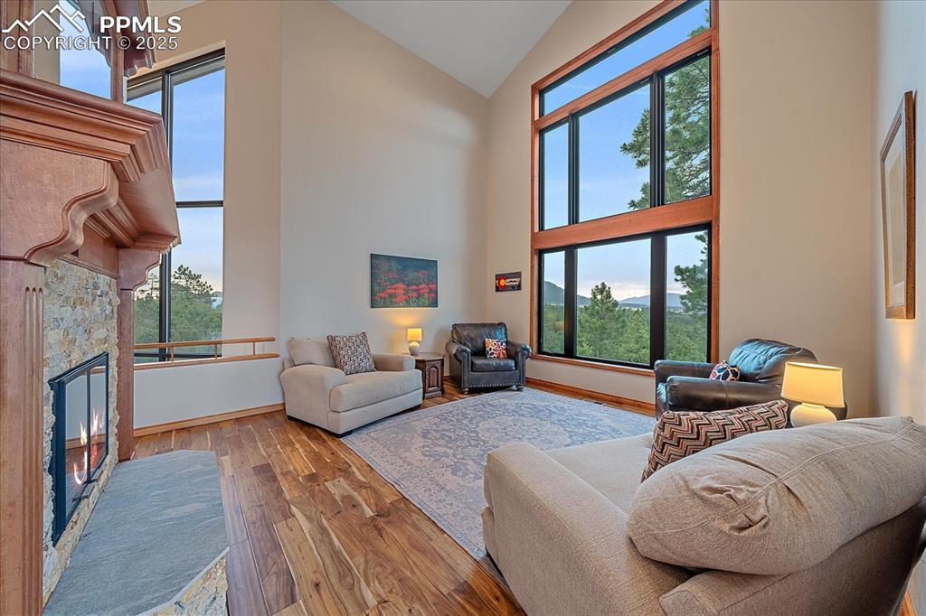 8045 Eagle Road Larkspur, CO 80118 - Photo 9 of 50 a living room with furniture and a large window