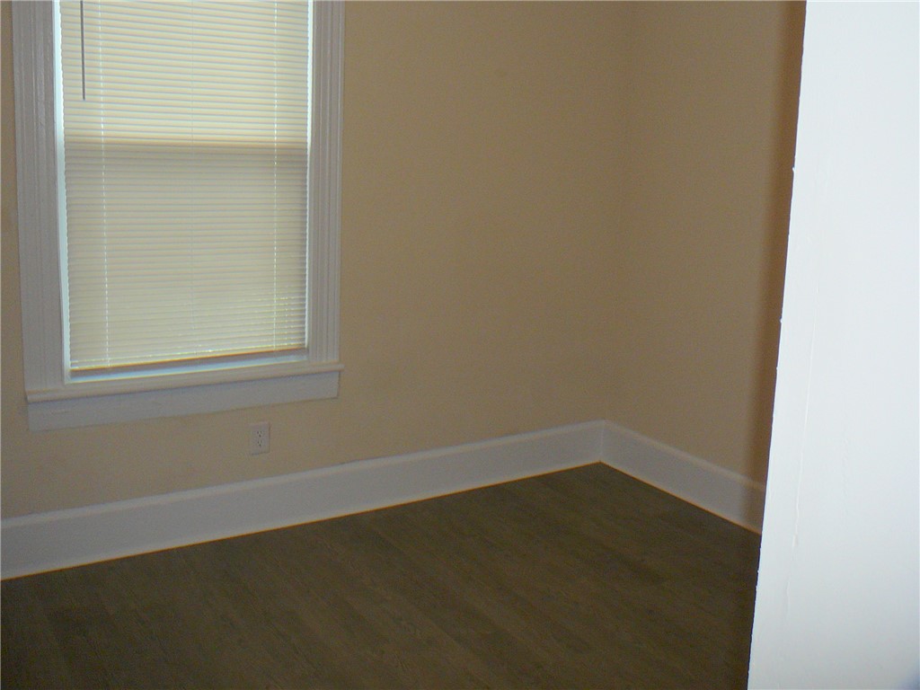 803 East Orr Street Anderson, SC 29621 - Photo 10 of 14 Rich wood-look flooring and crisp white trim accent this versatile corner space.