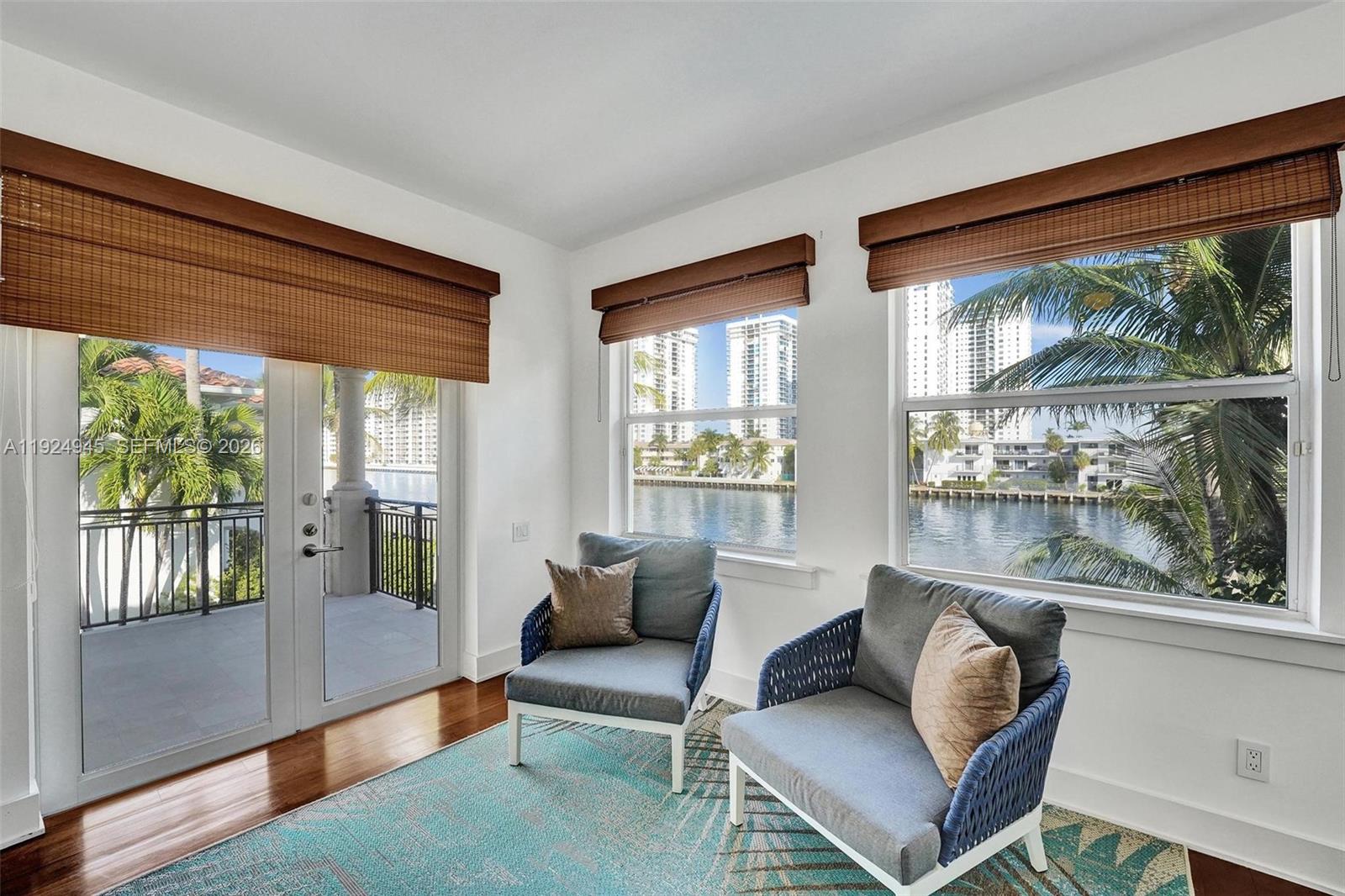 1575 Windjammer Way Hollywood, FL 33019 - Photo 22 of 42 a living room with furniture and a window