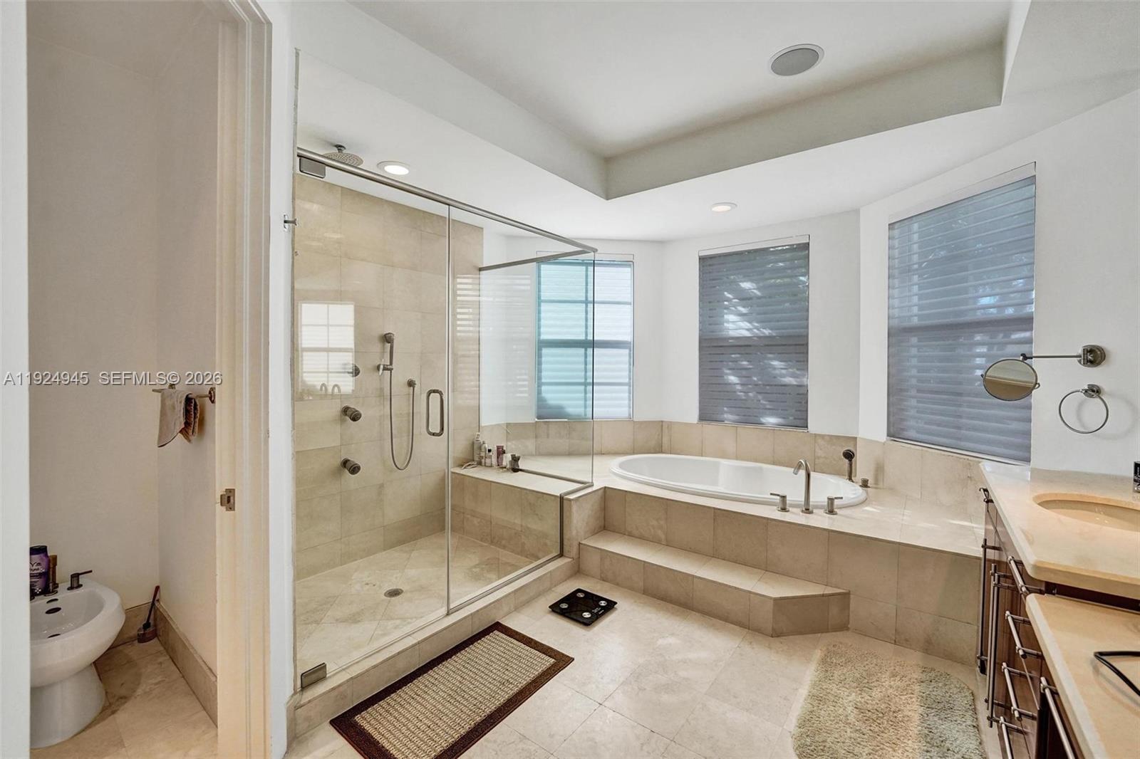 1575 Windjammer Way Hollywood, FL 33019 - Photo 27 of 42 a bathroom with a tub shower and sink