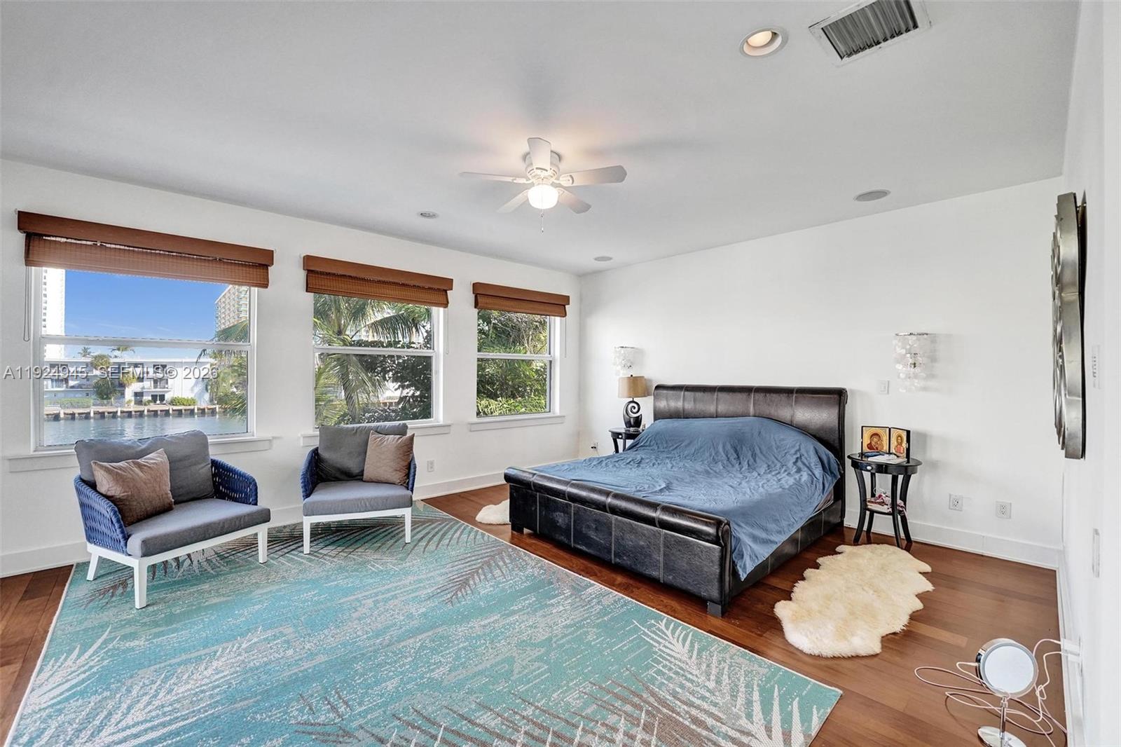 1575 Windjammer Way Hollywood, FL 33019 - Photo 28 of 42 a living room with furniture and wooden floor