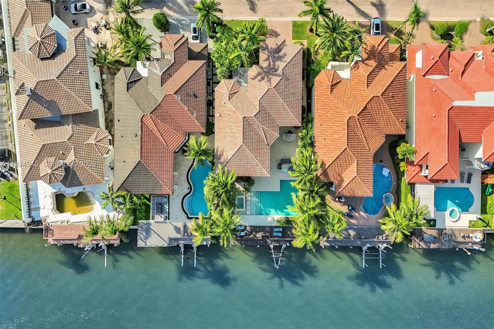 1575 Windjammer Way Hollywood, FL 33019 - Photo 3 of 42 an aerial view of a house with a yard and sitting area