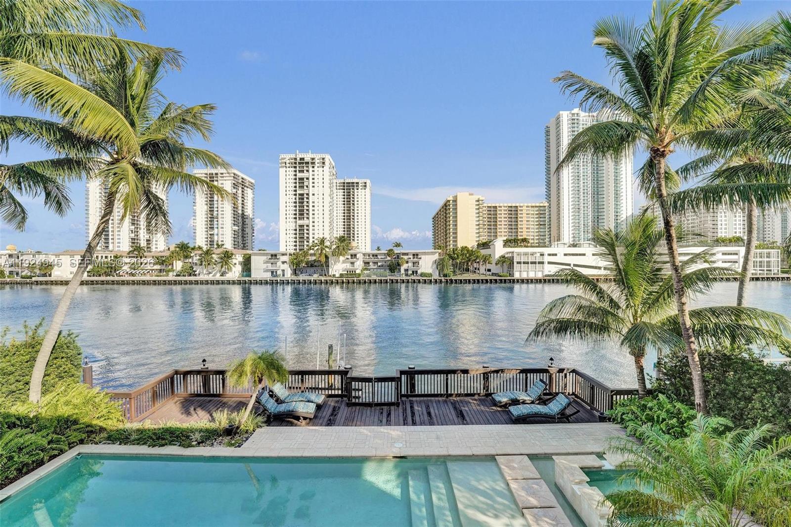 1575 Windjammer Way Hollywood, FL 33019 - Photo 37 of 42 a view of a lake with a city