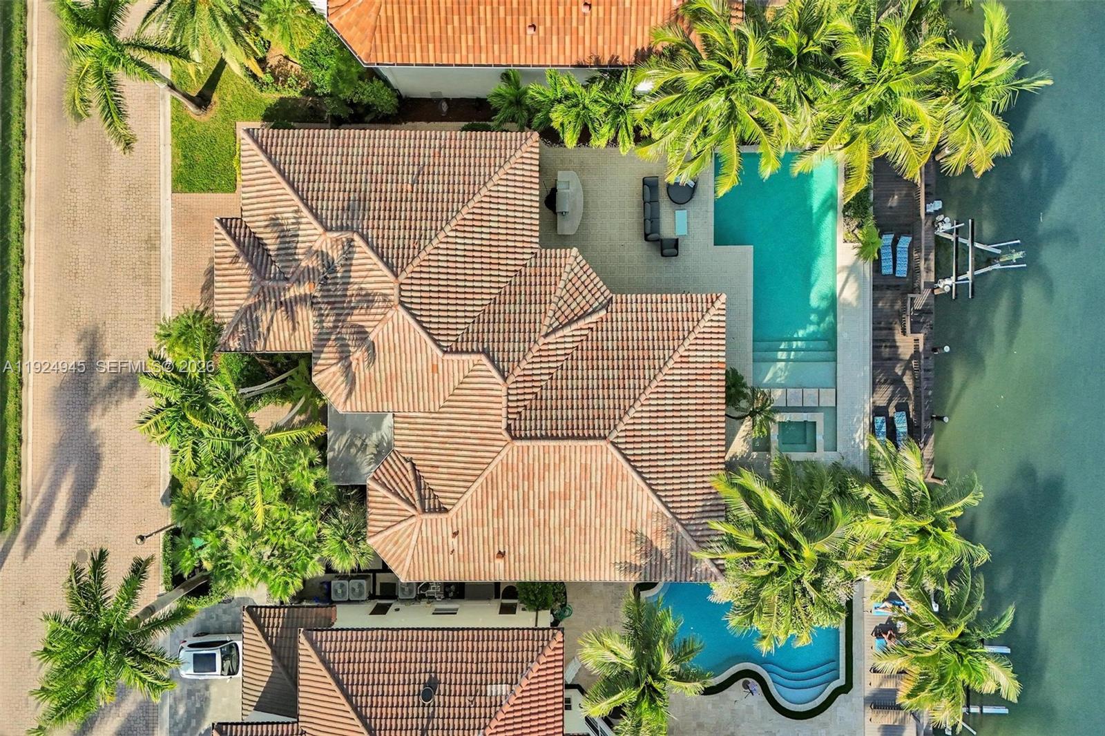 1575 Windjammer Way Hollywood, FL 33019 - Photo 4 of 42 a aerial view of a house with a yard and sitting area