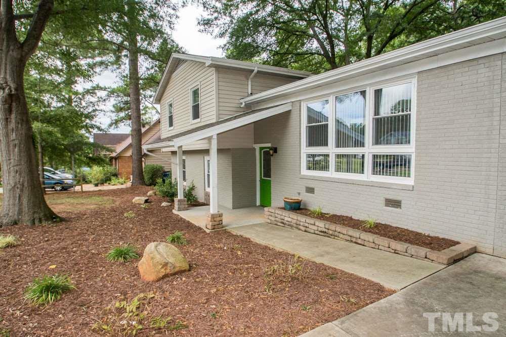 708 Merwin Road Raleigh, NC 27606 - Photo 1 of 25 a view of a house with a yard and large tree