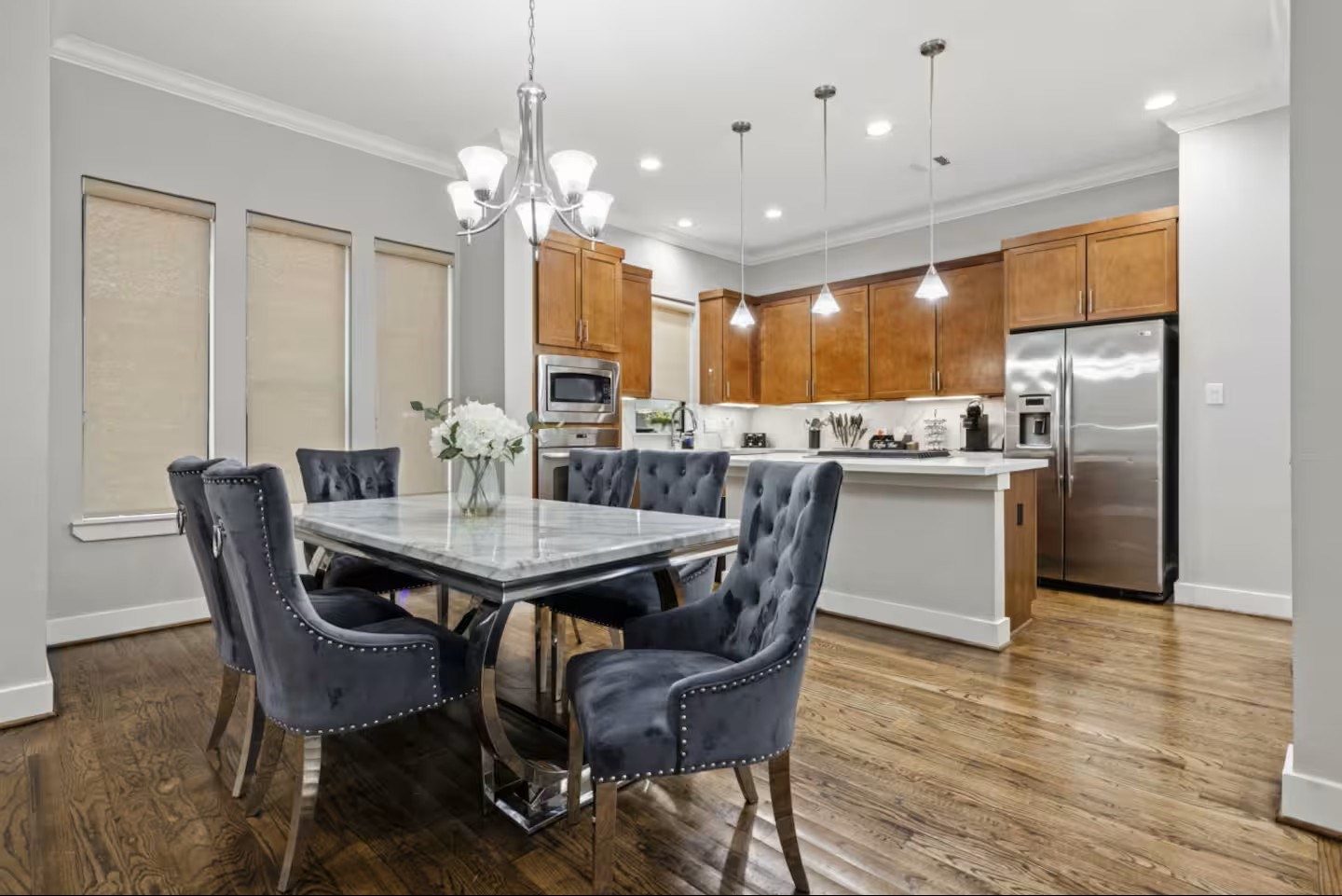 1205 Detering Street Houston, TX 77007 - Photo 12 of 30 a dining room filled chandelier and kitchen view