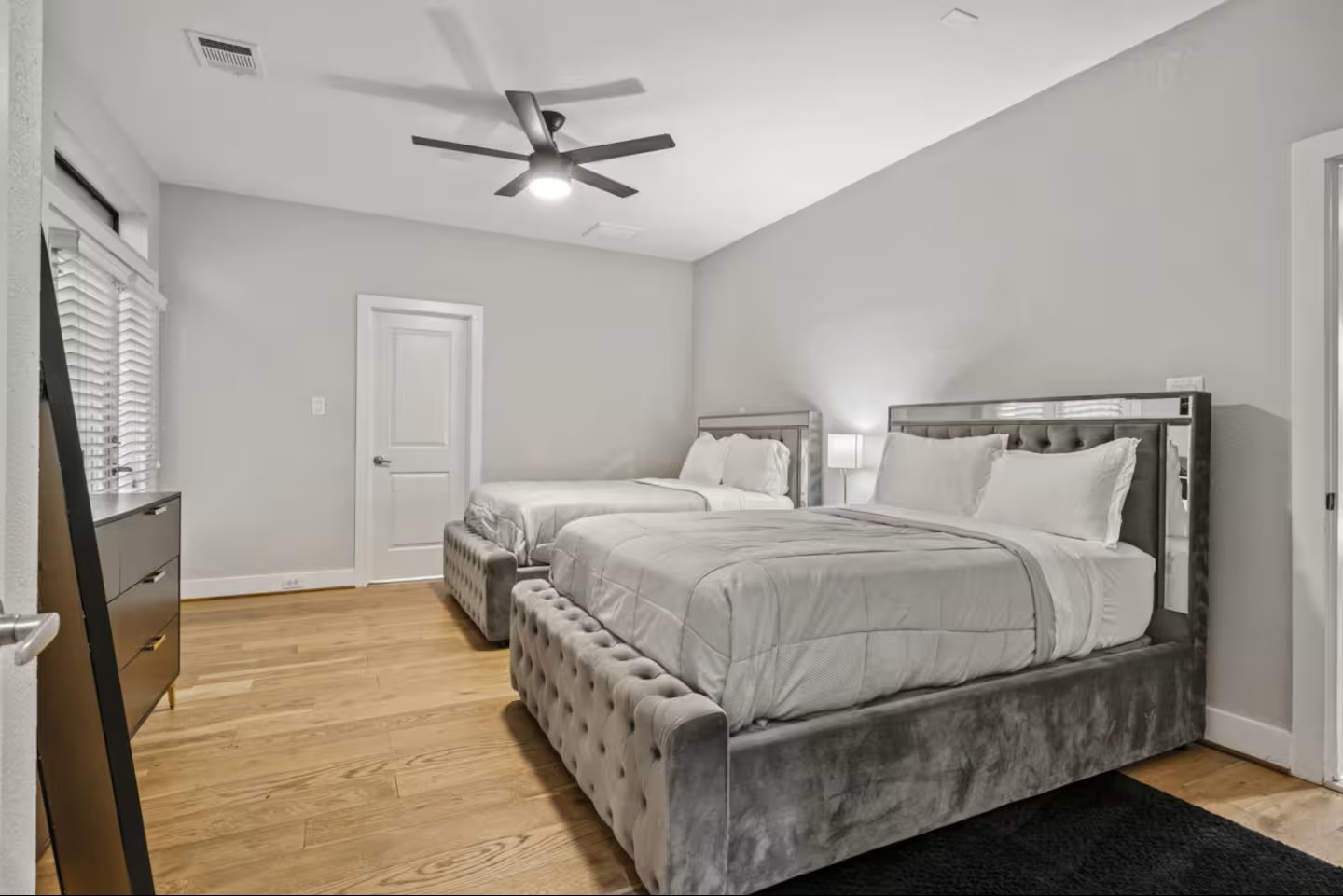 1205 Detering Street Houston, TX 77007 - Photo 18 of 30 a bedroom with a bed and a flat screen tv