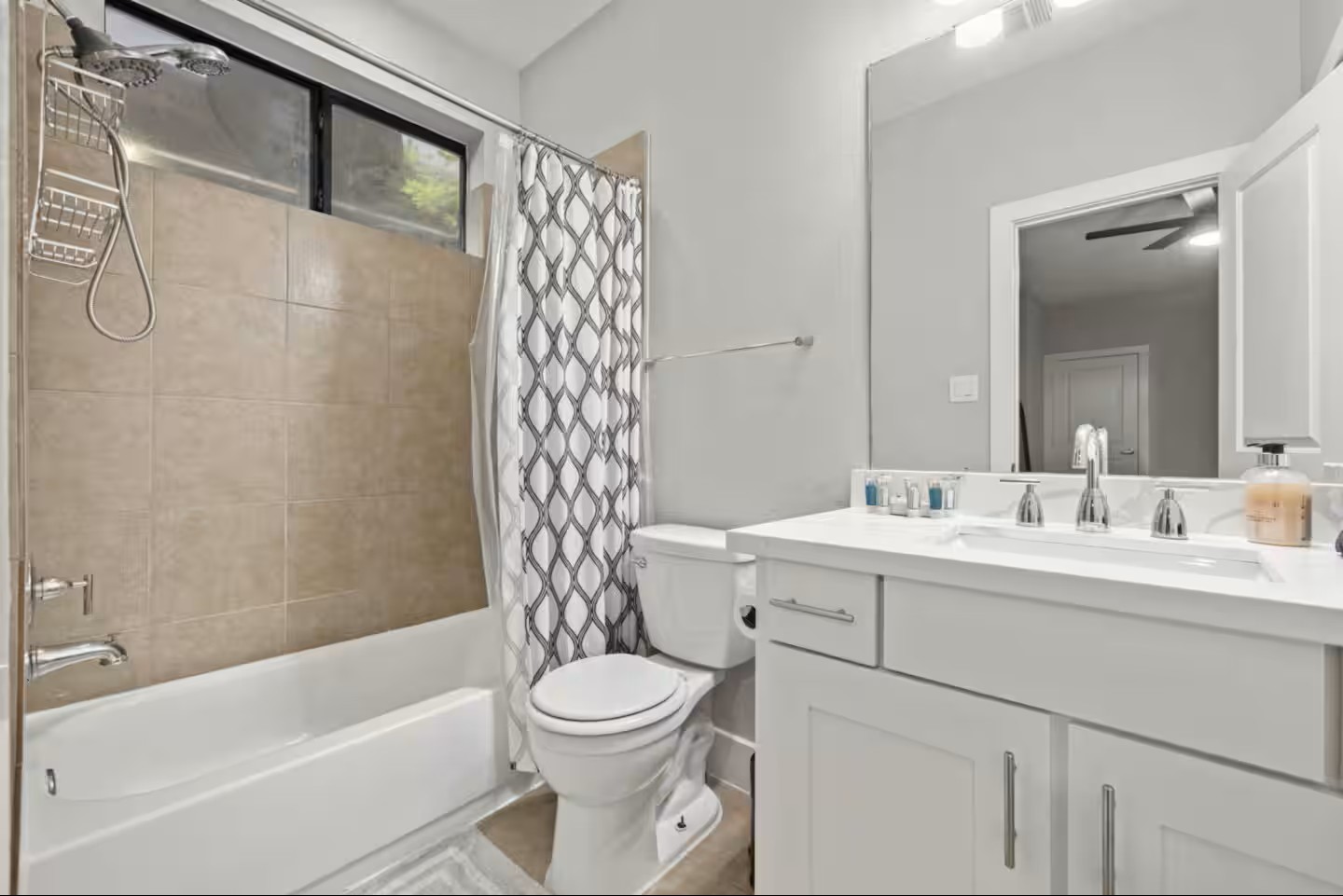 1205 Detering Street Houston, TX 77007 - Photo 19 of 30 a bathroom with a sink a toilet and shower