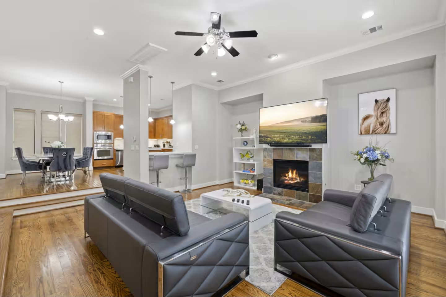 1205 Detering Street Houston, TX 77007 - Photo 2 of 30 a living room with furniture fireplace and a flat screen tv
