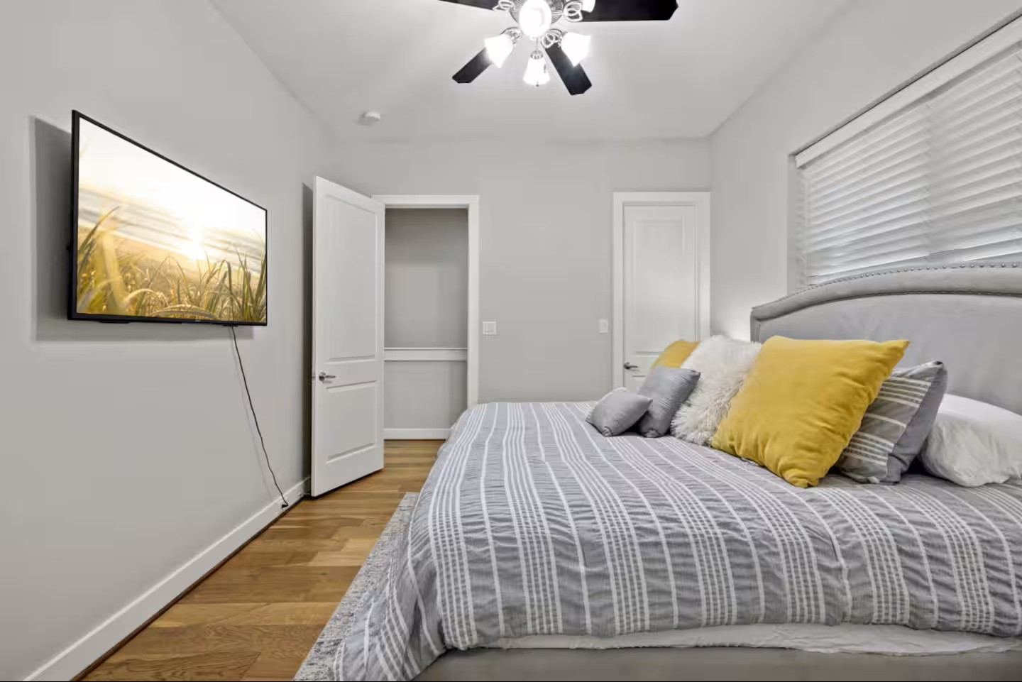 1205 Detering Street Houston, TX 77007 - Photo 24 of 30 a bedroom with a large bed and a ceiling fan