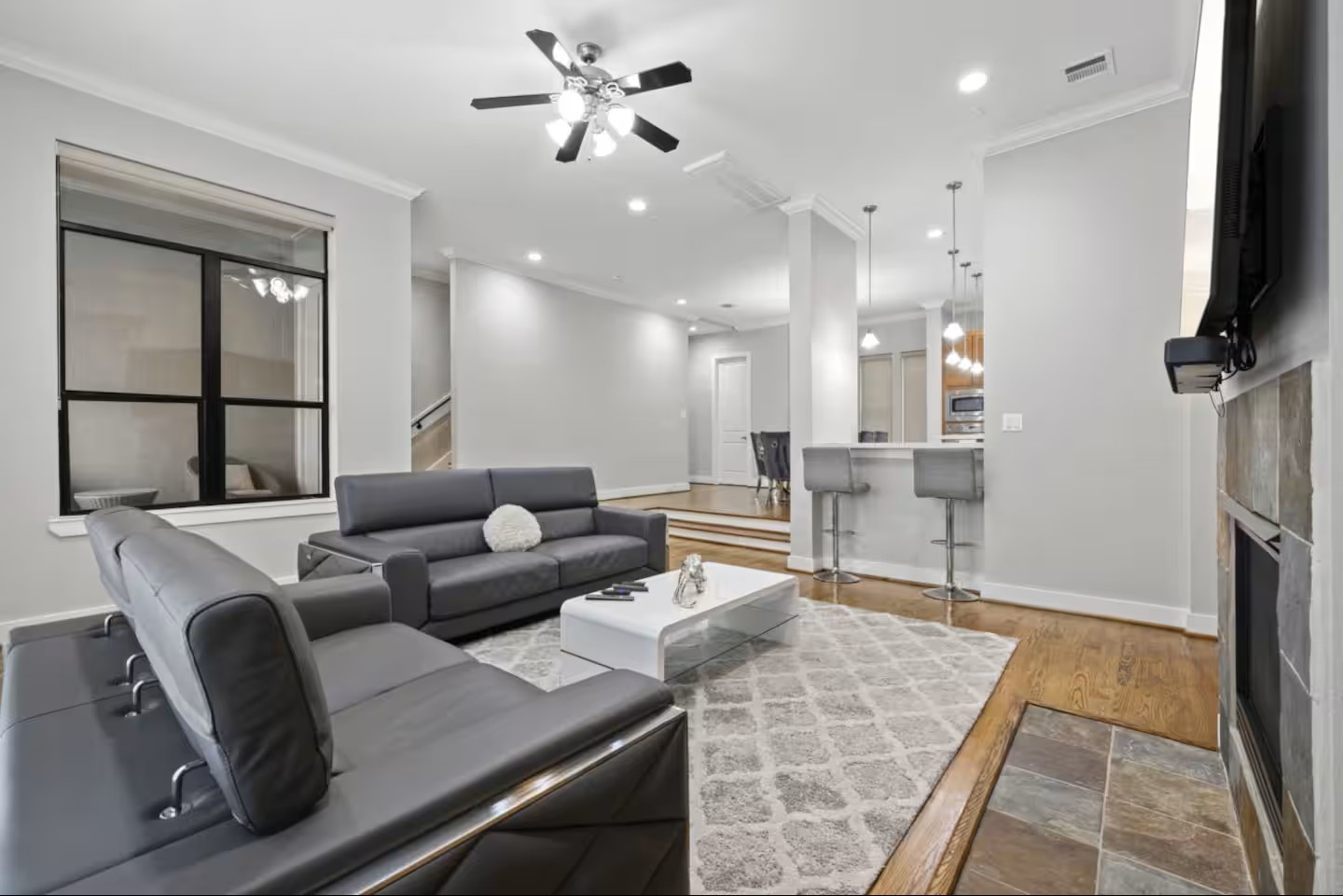 1205 Detering Street Houston, TX 77007 - Photo 5 of 30 a living room with furniture a large window and a fireplace