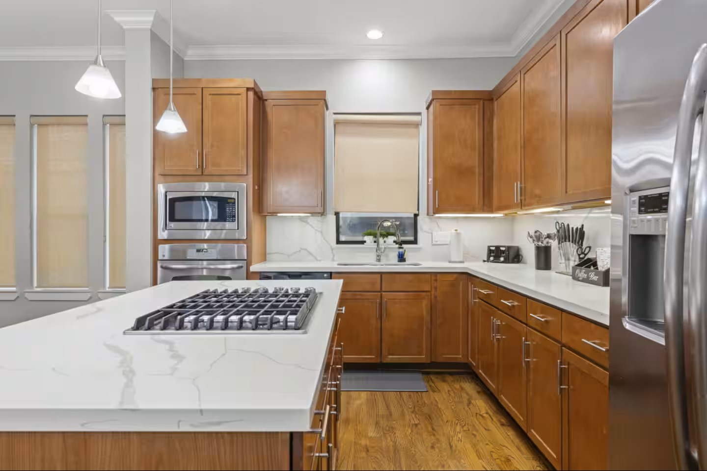 1205 Detering Street Houston, TX 77007 - Photo 8 of 30 a kitchen with stainless steel appliances granite countertop a stove a sink dishwasher and a refrigerator with wooden cabinets