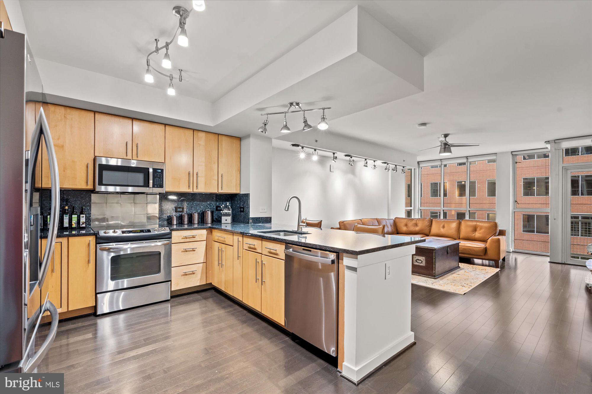 a kitchen with lots of counter top space and appliances