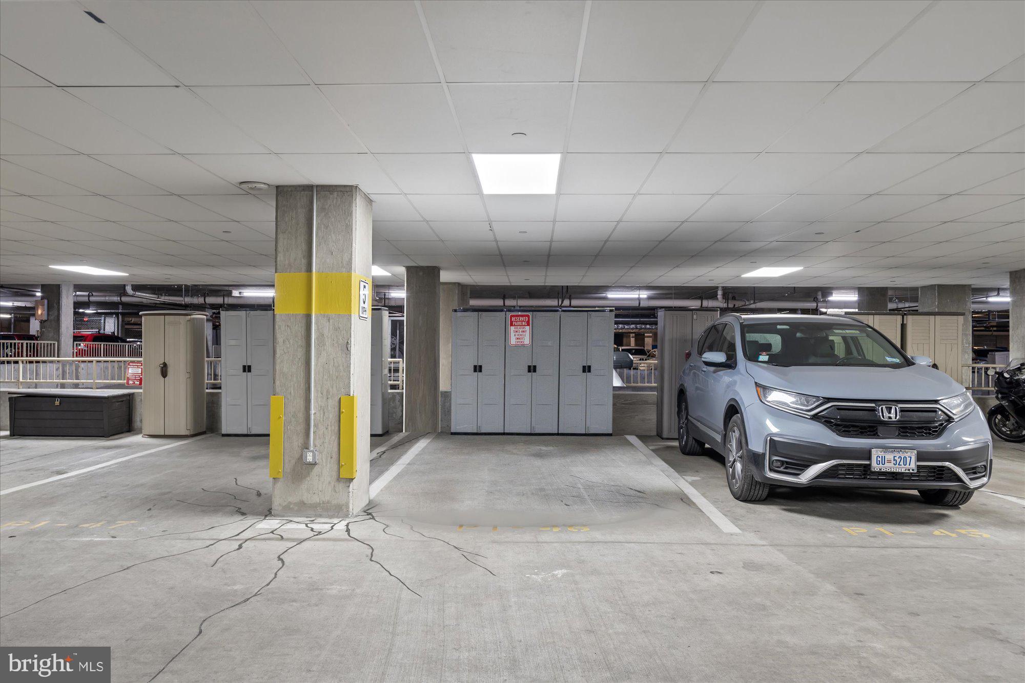 1025 First Street Southeast, Unit 511 Washington, DC 20003 - Photo 14 of 25 a view of parking garage with cars parked