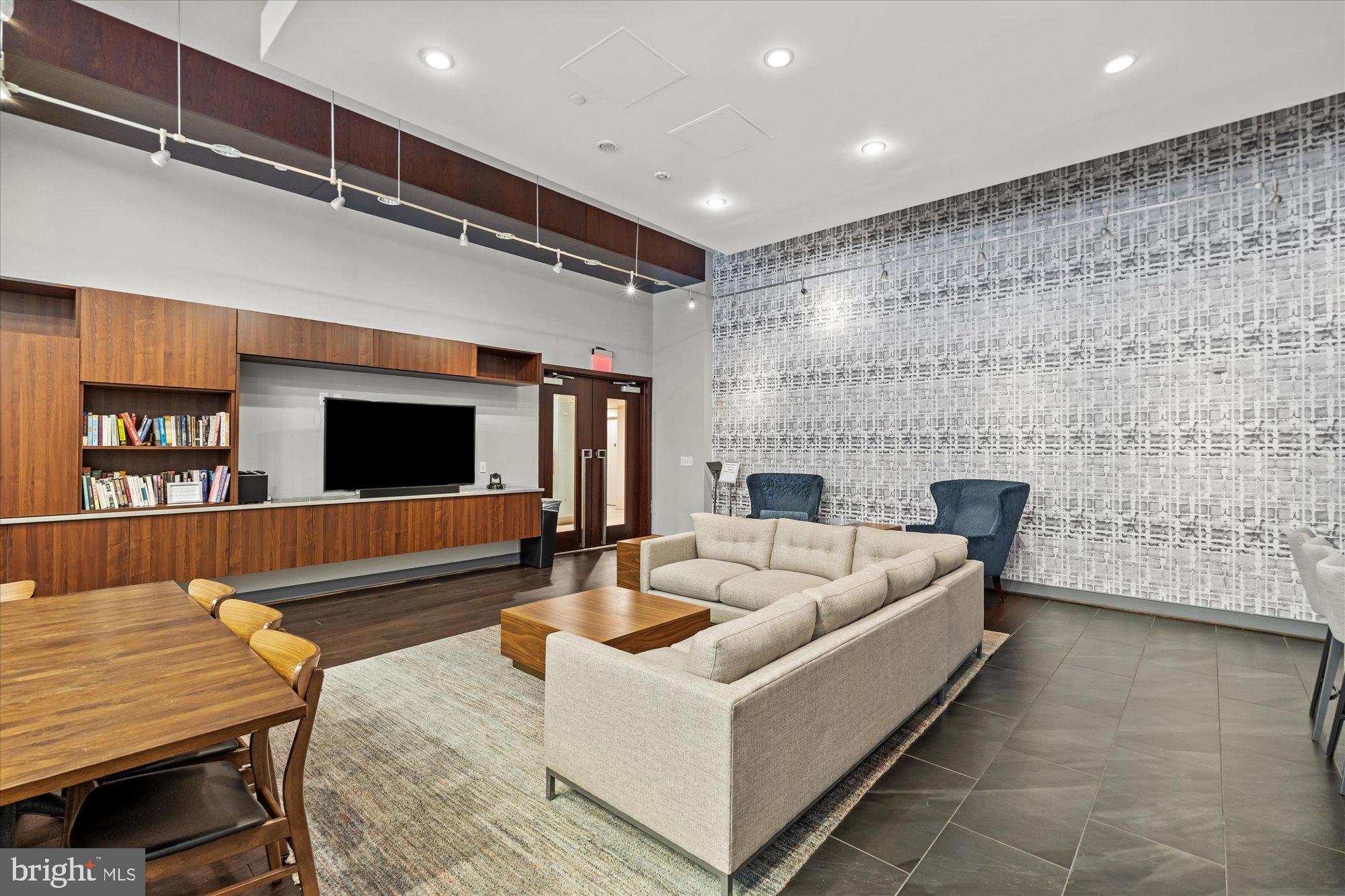 1025 First Street Southeast, Unit 511 Washington, DC 20003 - Photo 15 of 25 a living room with furniture and a fireplace