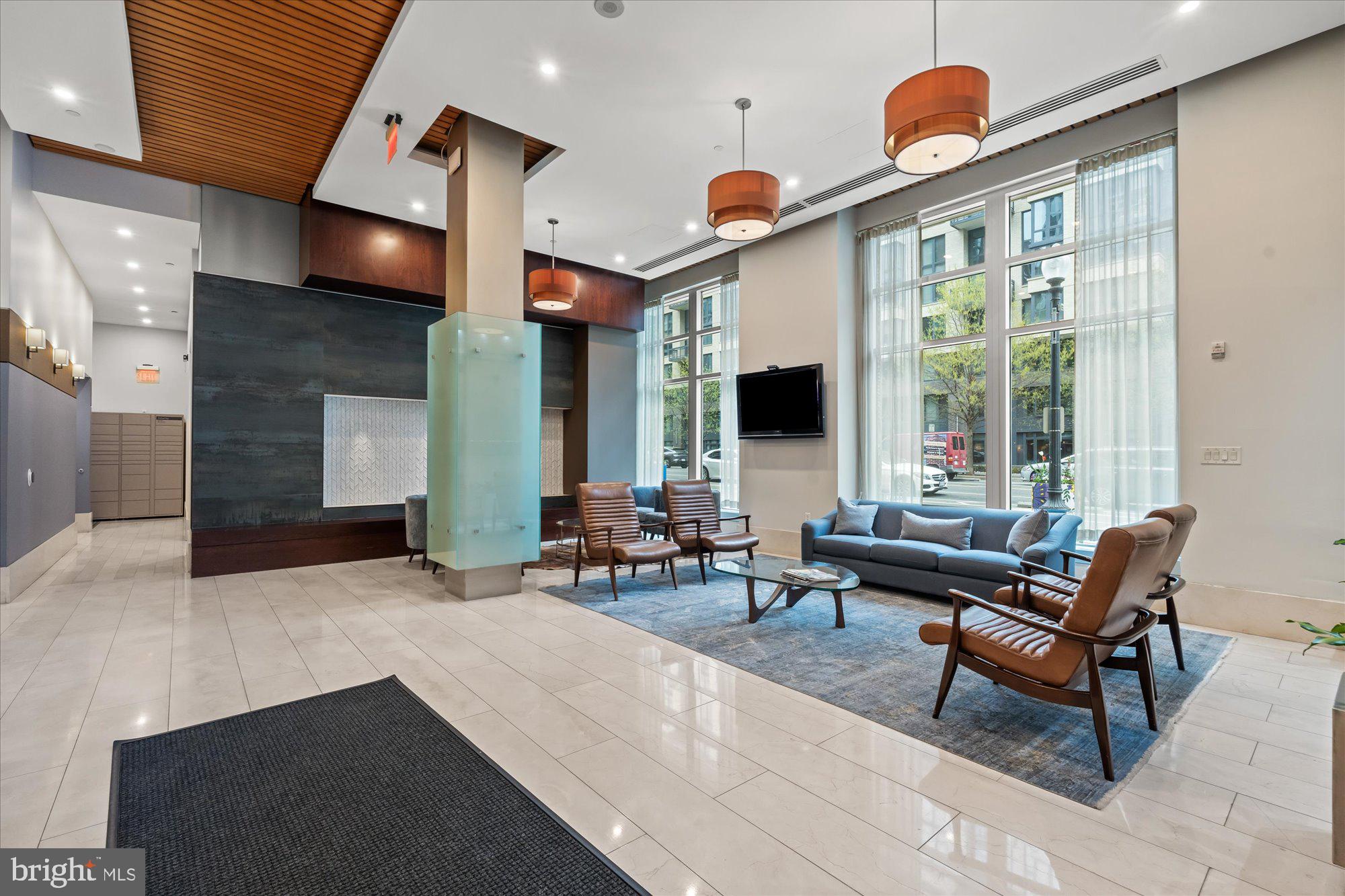 1025 First Street Southeast, Unit 511 Washington, DC 20003 - Photo 16 of 25 a living room with fireplace furniture and a large window