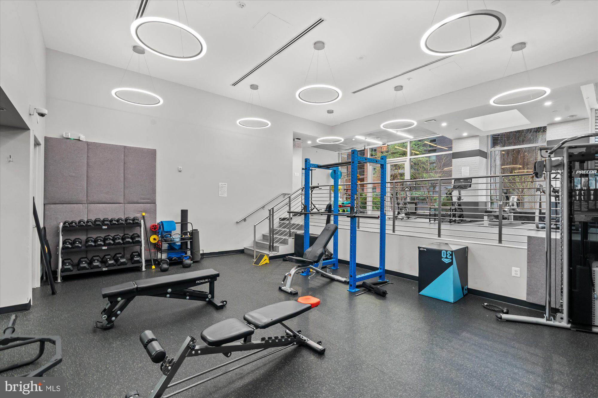 1025 First Street Southeast, Unit 511 Washington, DC 20003 - Photo 19 of 25 a room with gym equipment and a large window