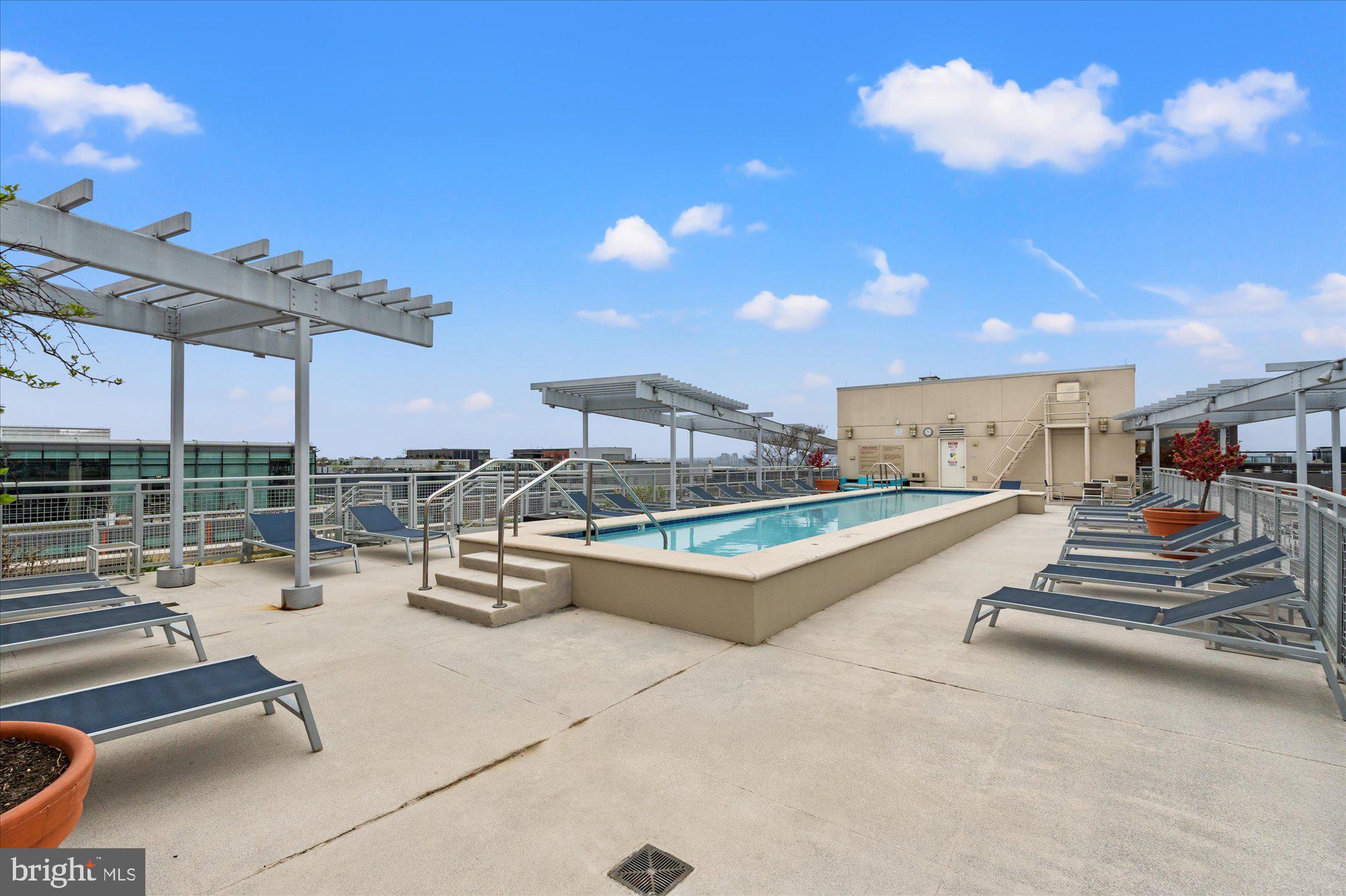 1025 First Street Southeast, Unit 511 Washington, DC 20003 - Photo 20 of 25 a view of a patio with a table and chairs