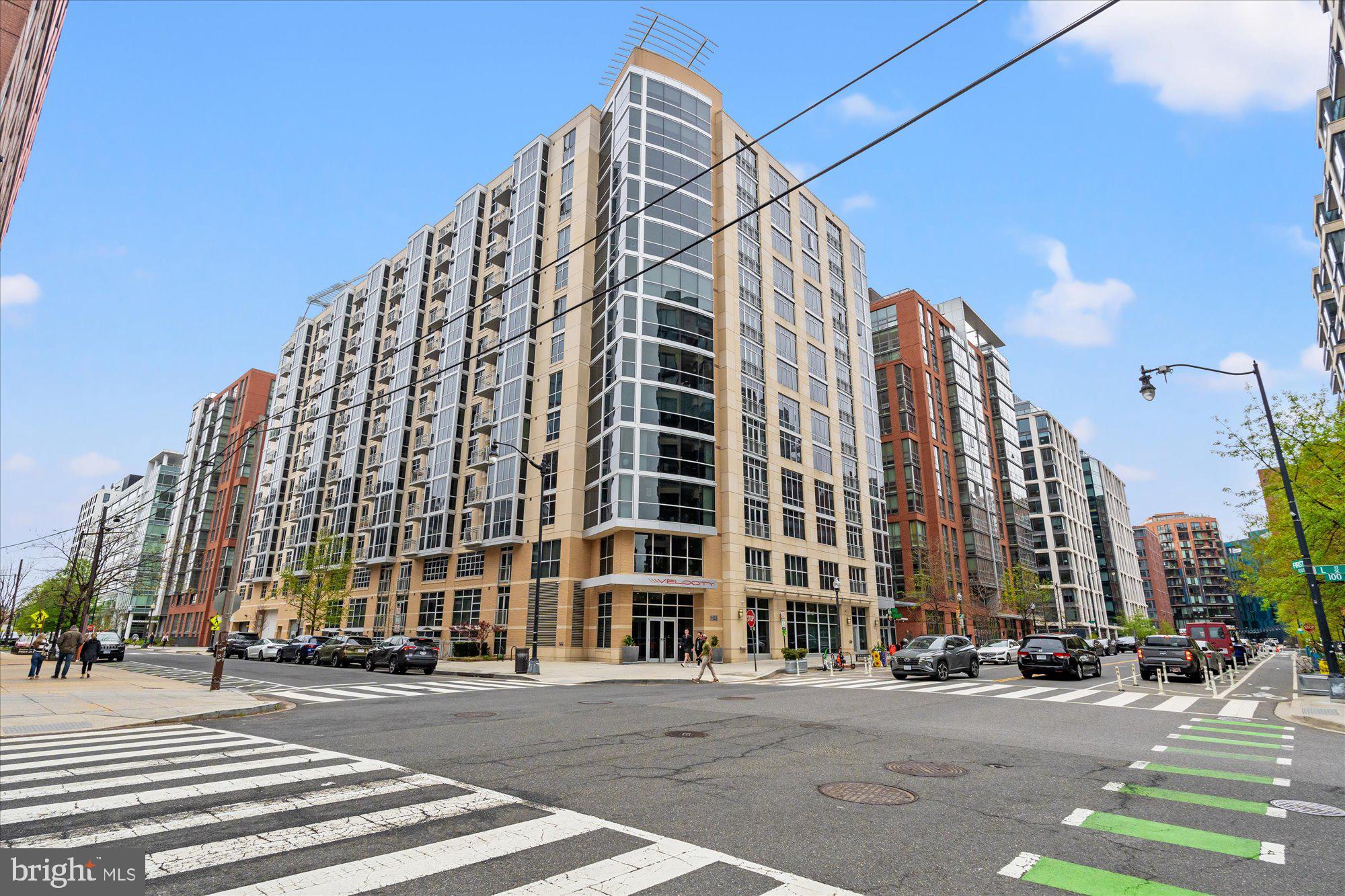 1025 First Street Southeast, Unit 511 Washington, DC 20003 - Photo 23 of 25 a view of a tall building sitting on the corner of a street