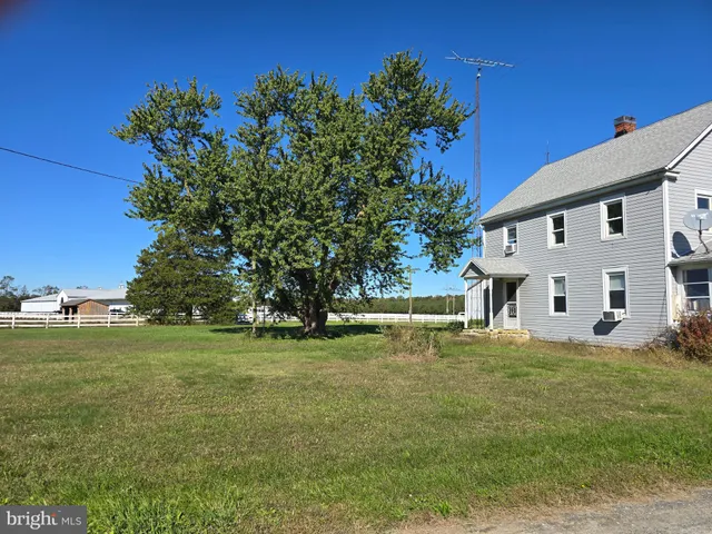 a view of a lake with houses in the background