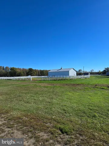 a view of a large body of water with a building in the background