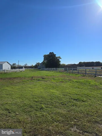 a view of a lake with houses in the background
