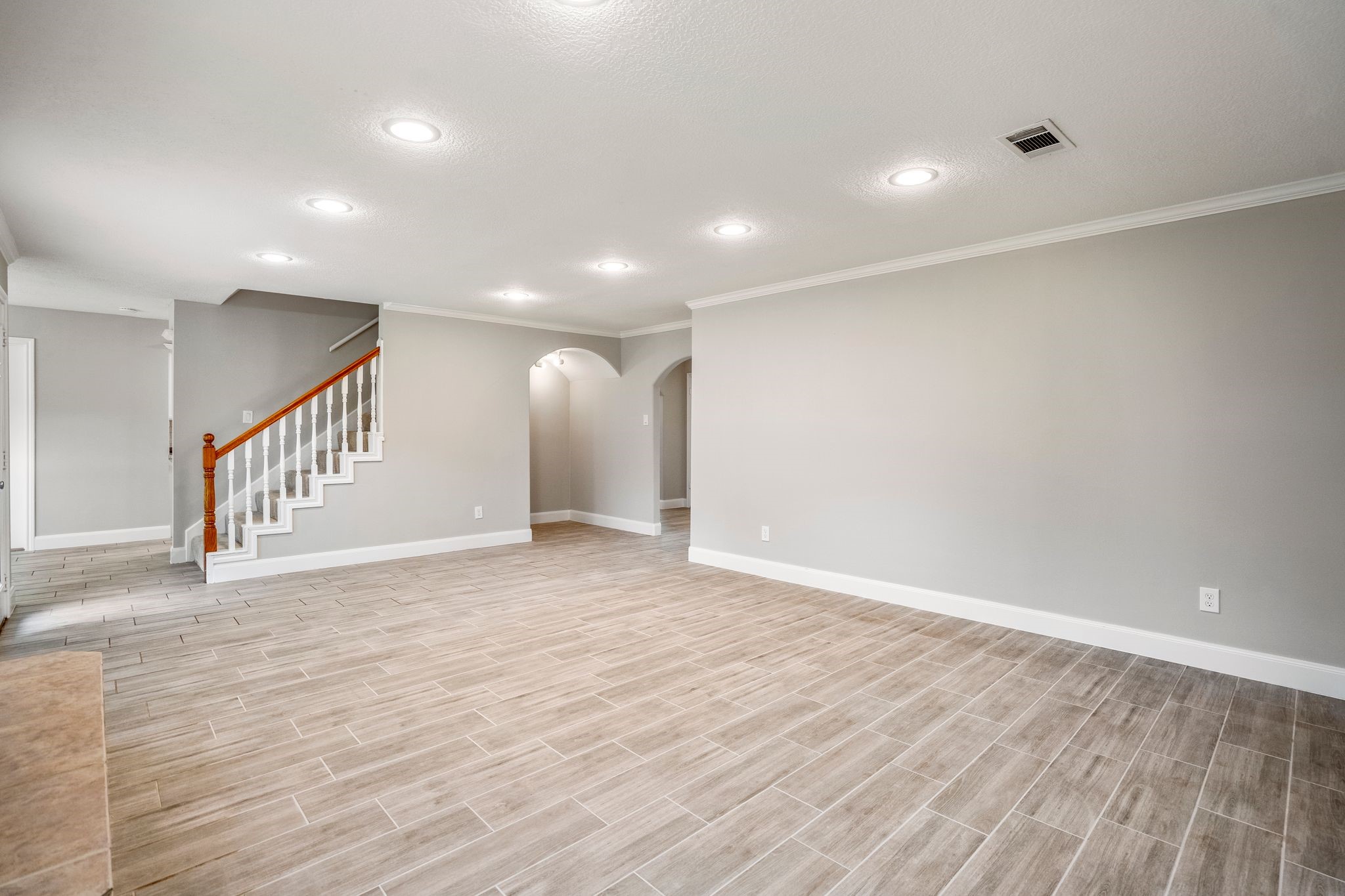 7607 Wycomb Lane Houston, TX 77070 - Photo 11 of 38 a view of an empty room with wooden floor