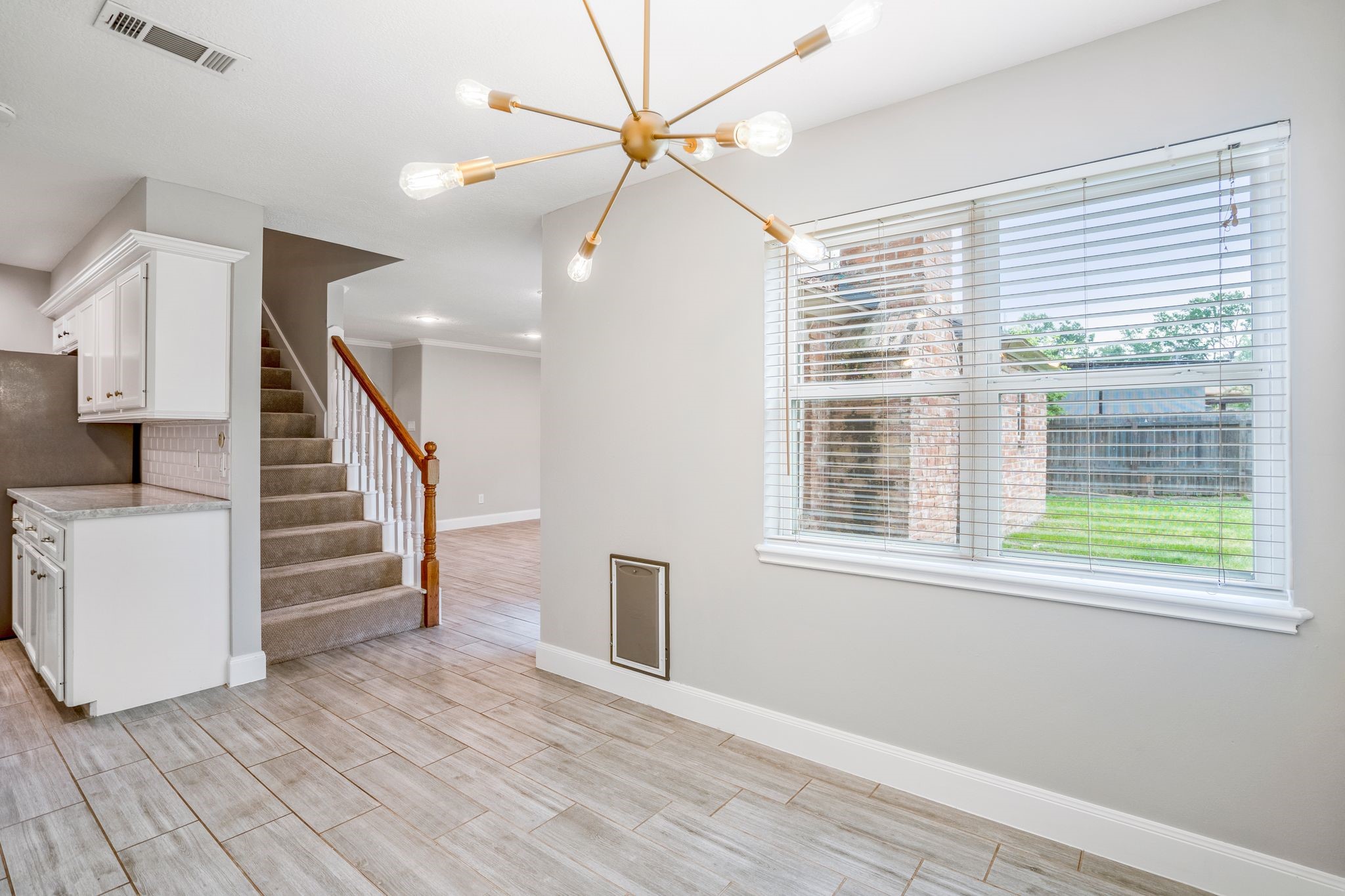 7607 Wycomb Lane Houston, TX 77070 - Photo 14 of 38 a view of empty room with wooden floor and fan