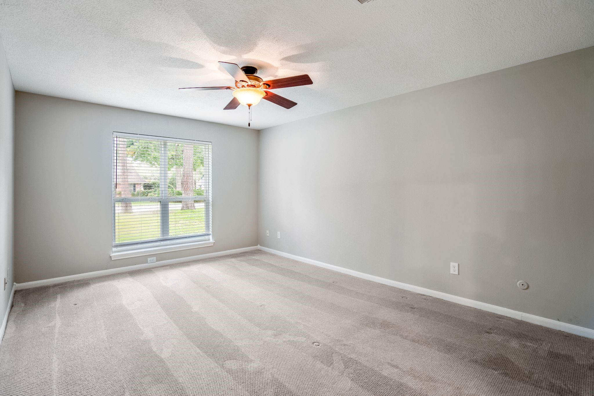 7607 Wycomb Lane Houston, TX 77070 - Photo 19 of 38 a view of an empty room with a window