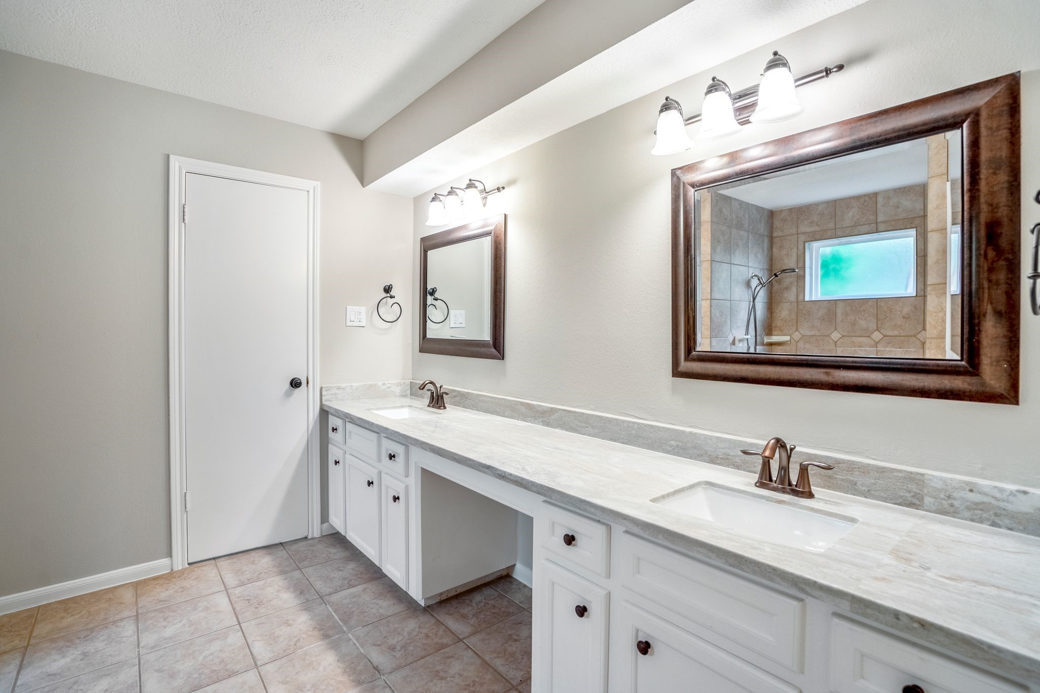7607 Wycomb Lane Houston, TX 77070 - Photo 22 of 38 a bathroom with a granite countertop sink vanity and mirror