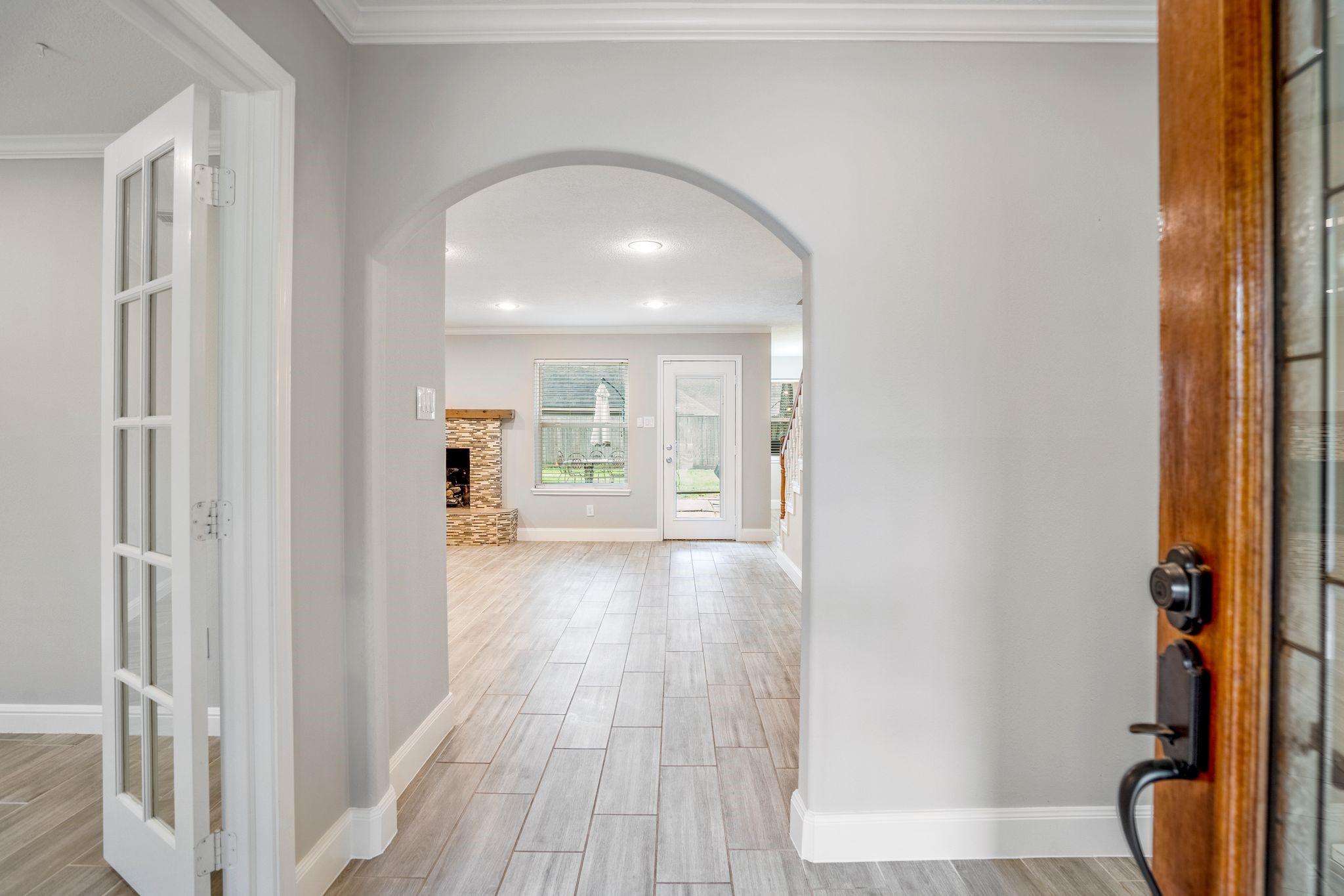 7607 Wycomb Lane Houston, TX 77070 - Photo 3 of 38 a view of hallway with wooden floor