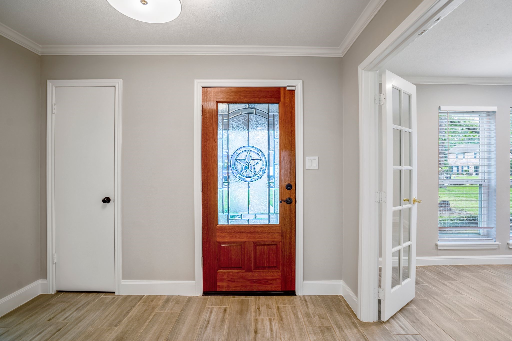 7607 Wycomb Lane Houston, TX 77070 - Photo 4 of 38 a view of an entryway with wooden floor