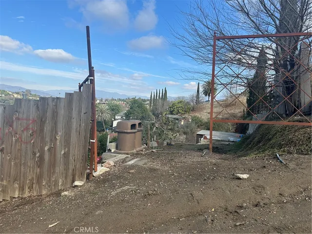 a view of a terrace with a table and chairs