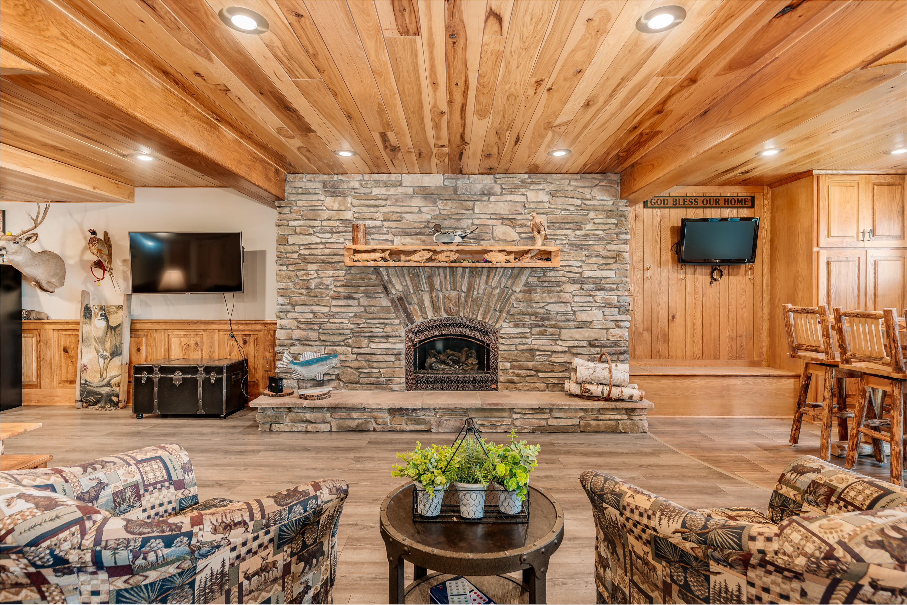 5420 West Peninsula Road Waterford, WI 53185 - Photo 4 of 65 12-foot-wide custom built gas fireplace with hammered copper front.