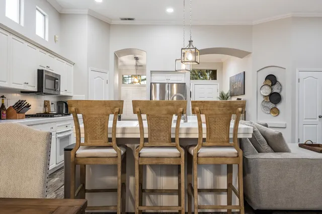 a living room with furniture and flat screen tv