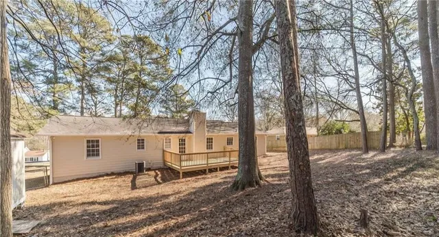 a house with trees in the background