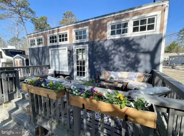 a front view of house with outdoor seating