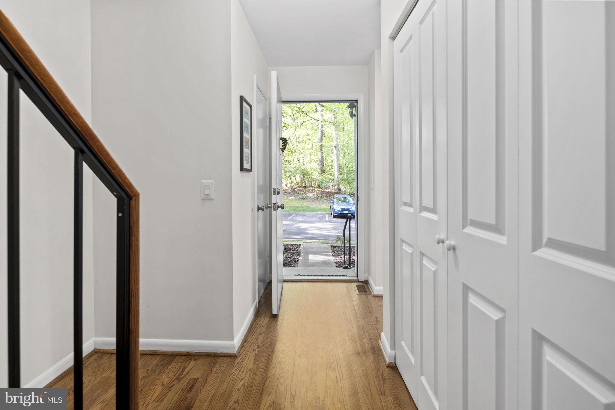 11740 Decade Court Reston, VA 20191 - Photo 3 of 44 Front door w/ coat closet & hardwoods throughout