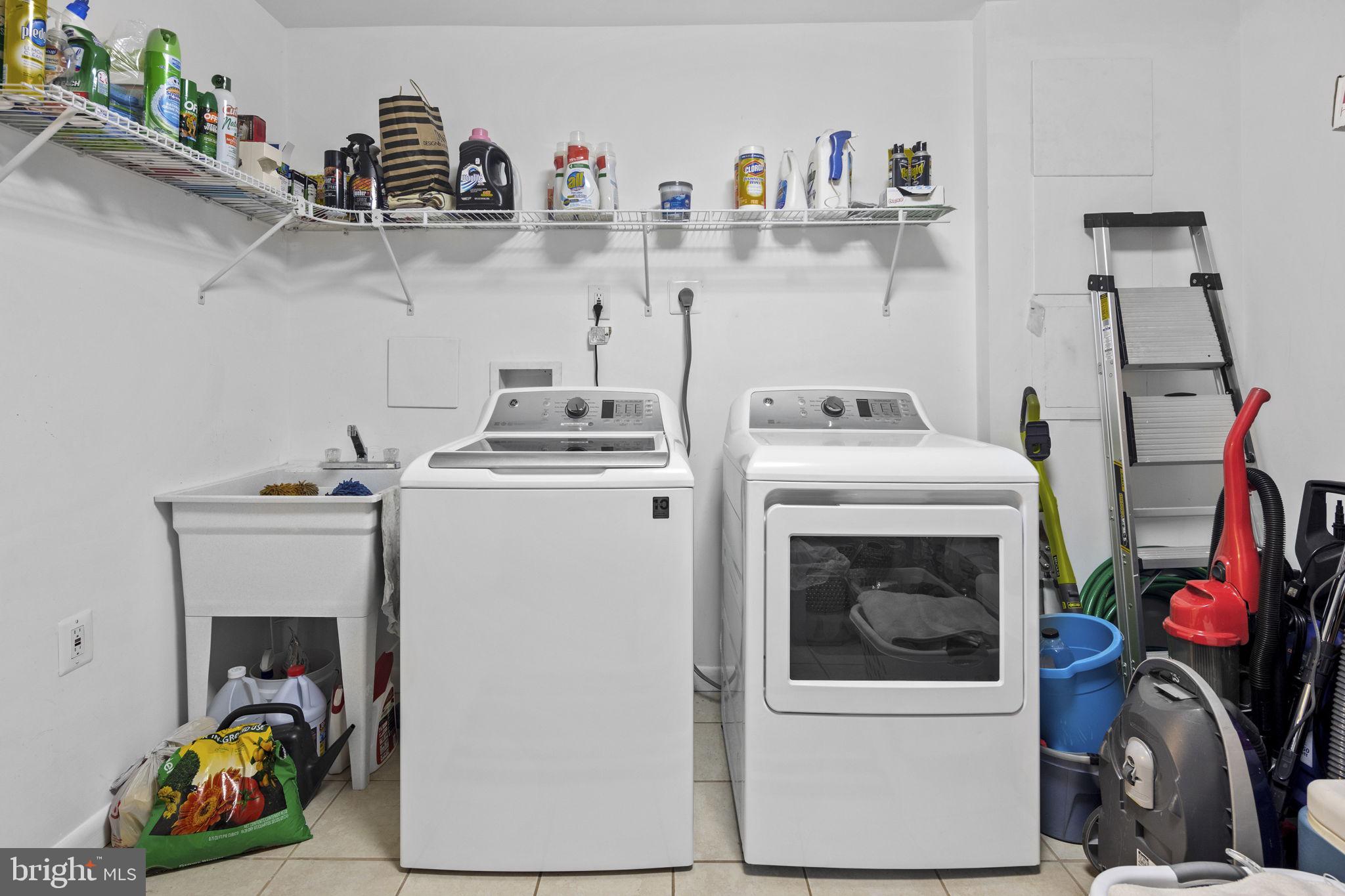 11740 Decade Court Reston, VA 20191 - Photo 40 of 44 LL storage room w/ top load wash & front load dry